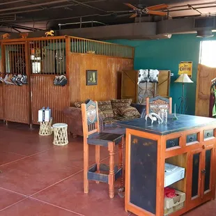 the inside of a horse barn