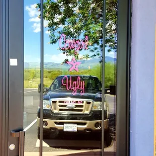 the reflection of a car in the window