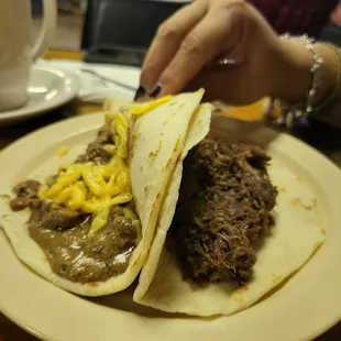 Carne guisada and barbacoa tacos