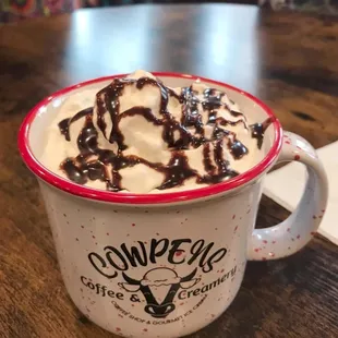 Chocolate mocha with lots of whipped cream and mocha drizzle!!  Total yumminess!!