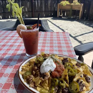 Chicken &amp; Asada nachos paired with a bloody mary!