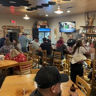 a large group of people sitting at tables