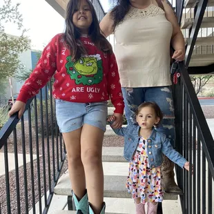 Wife and kids wearing their boots purchased at Cowtown Boots.