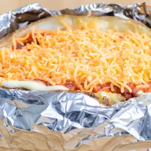 a cheesy baked dish in foil