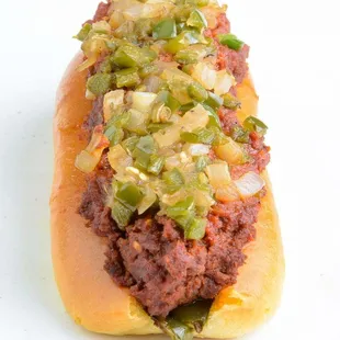 a hot dog with onions and peppers