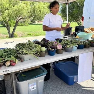 a woman selling vegetables