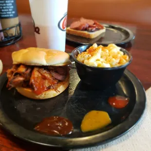 Smokestack sandwich with mac and jack, and a side of texas smoked sausage in the back