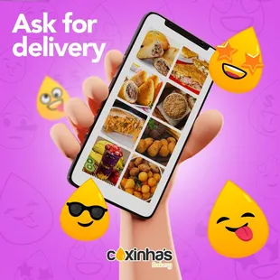 a hand holding a phone with a bunch of food on it
