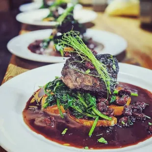 Our excellent Short Rib with roasted sweet potatoes and tart cherries on spinach bed