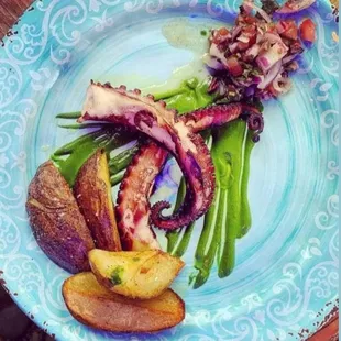 Octopus with olive tapenade, roasted potatoes.