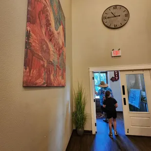 a woman walking down the hallway