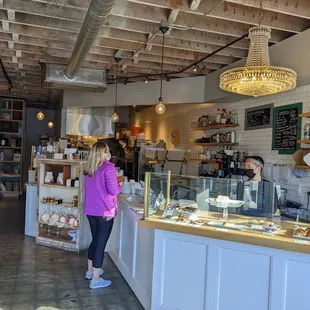 a woman standing in front of the counter