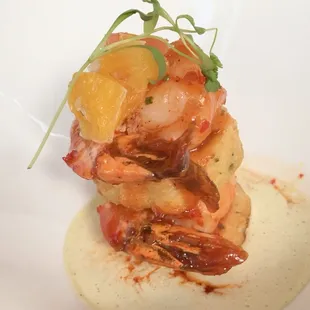 a plate of shrimp and grits