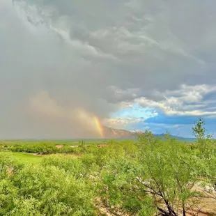 a rainbow in the distance