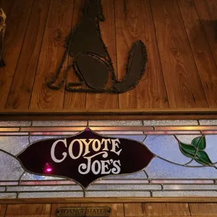 a stained glass window and a cow skull