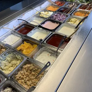 a variety of salads and condiments