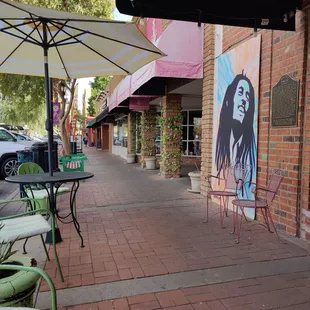 a street scene with tables and chairs