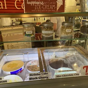 a display case with a variety of ice creams