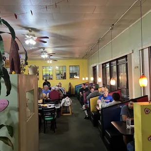 diners sitting at tables in a restaurant
