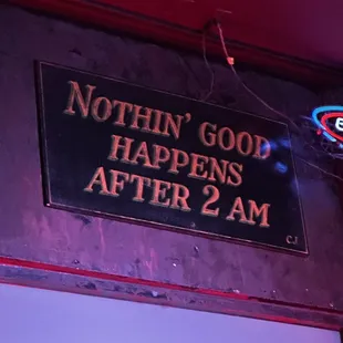 a sign saying nothing god happens after 2 am