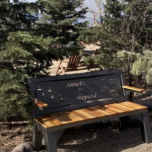 a bench with a sign on it