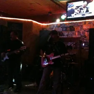 a band playing in a dimly lit room
