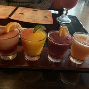 Margarita flight sangria, strawberry/mango (sooooo yummy) blueberry (also so yummy) and peach! Also a regular strawberry margarita.