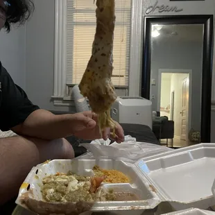 a man sitting at a table with food