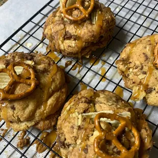 Kitchen Cleanout getting their caramel drizzle, pretzel and chip topping.