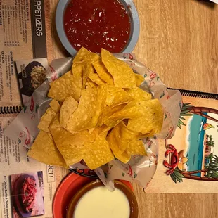 Tortilla chips with their delicious salsa and cheese dip.