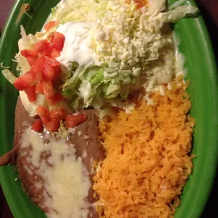 Enchiladas Jalisco (2 corn tortillas stuffed with crab &amp; mini shrimp) topped with lettuce, tomatoes, sour cream &amp; grated cheese.