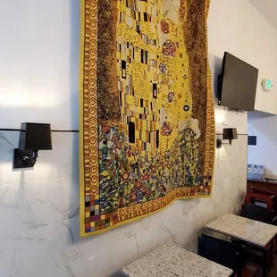 a tapestry hanging on the wall