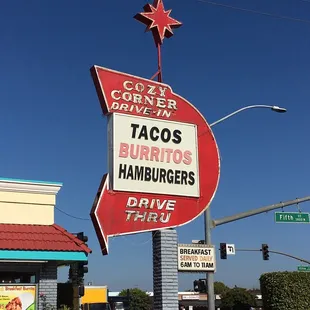a taco's burgers hamburgers drive thru sign