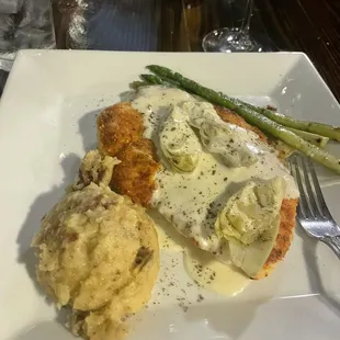 Thursday chicken special. So yummy. Tenderized chicken with lemon cream sauce and artichokes. Mashed potatoes and asparagus.