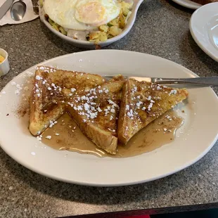 a plate of french toast and eggs