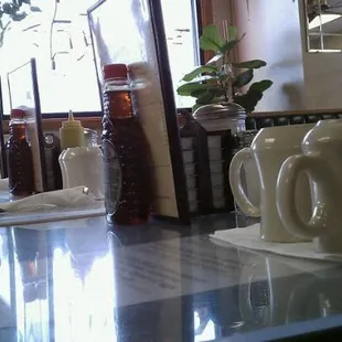 a table with a cup of coffee on it