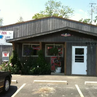 a car parked in front of a cozy inn