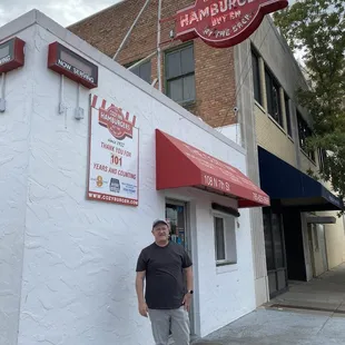 My son Ron, standing in front of the Cozy Inn. Looks the same today as it did when I  was a kid.