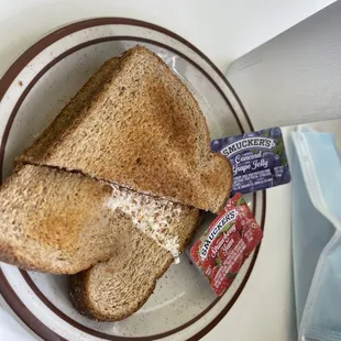 a plate of toasted bread and a bag of yogurt