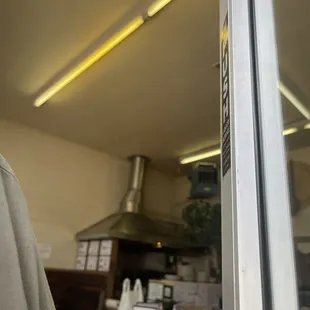 a man standing in front of a window