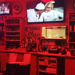 a man and a woman kissing in a bar