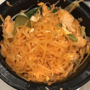 a bowl of noodles and chicken