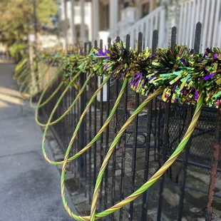 a row of garlands on a fence