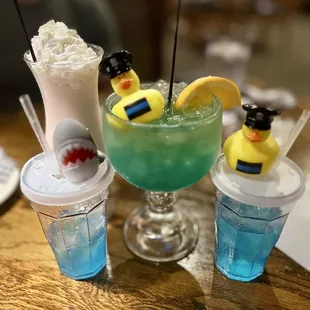 Kid&apos;s drinks (Gatorade with lids, candy eaten). Adult frozen strawberry concoction and the Quack (or similar for drink names).