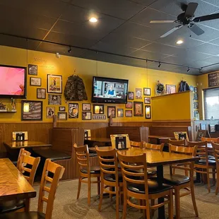 a dining area with tables and chairs