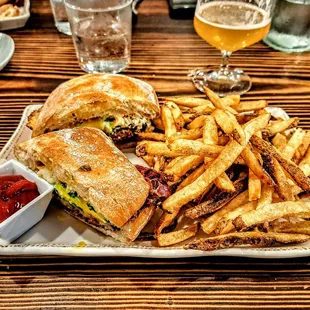Pastrami Poblano: 9 day house cured pastrami, roasted poblano pepper, chipotle mayo, provolone, cilantro, runny egg, on ciabatta. $18