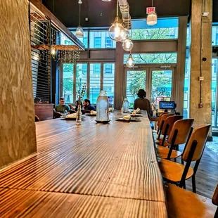 a long wooden table in a restaurant