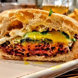 Pastrami Poblano: 9 day house cured pastrami, roasted poblano pepper, chipotle mayo, provolone, cilantro, runny egg, on ciabatta. $18