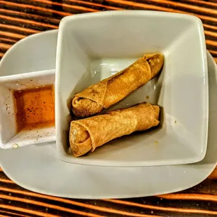 Classic Cigars: fried spring roll wrapper with Moroccan spiced house ground brisket, served with lemon honey pequin dipping sauce. $10