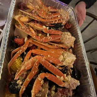 a person holding a tray of food
